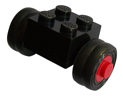 Black LEGO 2x2 modified brick assembly with smooth small dually tires, red wheel hubs, and top studs.