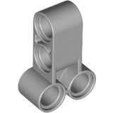 A light bluish gray LEGO Technic Pin Connector Perpendicular Double 3L, featuring two pinholes vertically and two at the base.