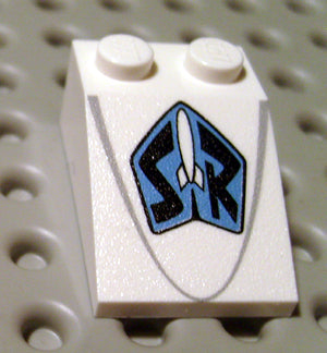 White LEGO Slope 33 3 x 2 with a blue shield pattern featuring a white rocket and black 'SR' letters, and a faint grey line.