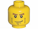 Yellow LEGO minifigure head with reddish brown thick eyebrows, black smirk, cheek lines, and chin dimple.