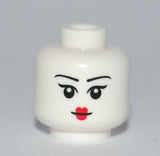 White LEGO minifigure head with black eyebrows, black pupils, and small red lips. Female pattern, slightly raised eyebrows.