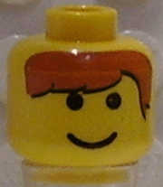 Yellow LEGO minifigure head with black eyes, smile, and printed brown hair bangs pattern.