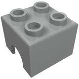 Gray LEGO Technic Engine Piston Square 2x2 with four studs on top and a curved cut-out on one side.