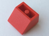 A single red LEGO 3660old inverted 45 2x2 slope brick with a solid round bottom tube, viewed from above.