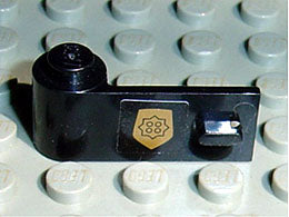 Black LEGO door 1x3x1 left with a gold World City Police badge pattern (88) sticker on a light grey baseplate.