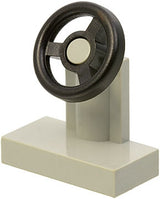 A light gray LEGO 3829c01 Vehicle, Steering Stand 1 x 2 with an attached black steering wheel.