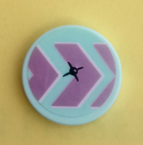 Round LEGO 2x2 tile with light blue, dark pink chevron pattern, and a black button-like star in the center on yellow.