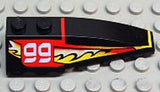 Black LEGO 6x2 right wedge with stylized white '99' on a red background and yellow flames pattern.