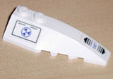 White LEGO 6x2 right wedge piece with blue radiation symbol and black striped Stealth Hunter pattern.