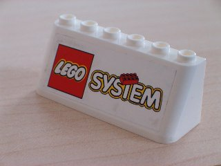 White LEGO 4176pb06 windscreen 2x6x2 brick with a LEGO System logo sticker. Part from sets 3308 and 3309.