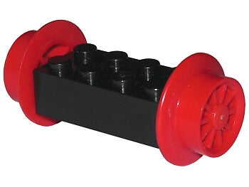 Black LEGO 2x4 modified brick with two red spoked train wheels and red pins attached.