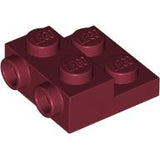 A dark red LEGO Plate, Modified 2 x 2 x 2/3 with 2 Studs on Side, showing four studs on top and two on the left side.