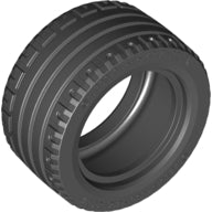 Angled view of a dark gray LEGO tire, part 44309, measuring 43.2 x 22 ZR, featuring a detailed tread.