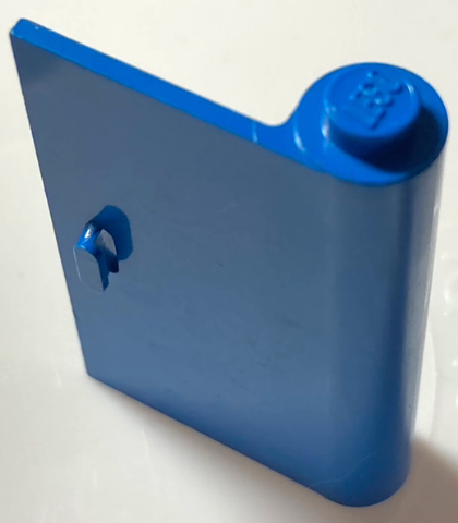 Blue LEGO Door 1 x 3 x 4 Right with angled top edge, a hinge element on the left, and LEGO logo on the top stud.