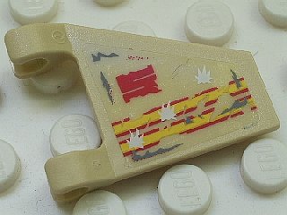 Close-up of a tan LEGO 44676pb005 trapezoid flag piece with yellow and red stripes, a red 'S', and white bullet hole patterns.
