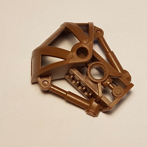 Brown LEGO Bionicle 47310 Toa Metru shoulder armor part, complex shape with connection points, on a white background.