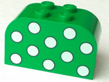 Green LEGO 4744px2 curved slope brick with 4 studs on top and white polka dots pattern on the front.