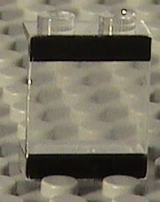 Clear LEGO Panel 1x2x2 with black stripes pattern on top and bottom.