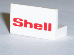 White LEGO 1x2x1 panel brick with the red 'Shell' logo printed on it, standing upright.