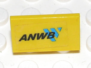 A yellow LEGO 1x2x1 panel with an ANWB sticker, featuring black text and a blue arrow logo.