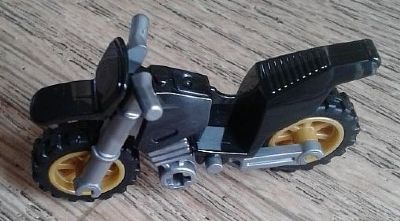 LEGO 50860c04 Motorcycle Dirt Bike with flat silver chassis, long fairing mounts, and pearl gold wheels.