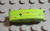 Lime green LEGO curved 3x1 slope with a black rectangular outline, small circle, and orange/red dots resembling rusted holes.