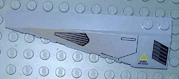 Light grey LEGO Wedge 10 x 3 Left with sticker showing black jet intake, exhaust ports, and a yellow danger sign.