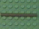Dark gray LEGO 5102c06 pneumatic hose, 4mm D., 6L long, on a green studded LEGO baseplate.