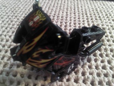 Black LEGO 52035pb07 motorcycle fairing with red and yellow flame stickers and a white '13' pattern from Set 8896.