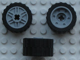 Three LEGO 55982c02 wheels, 18mm D. x 14mm, with 24x14 shallow tread tires, shown from different angles.