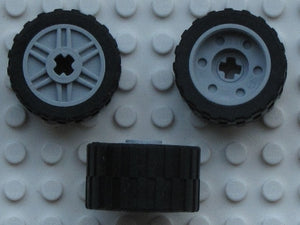 Three LEGO 55982c02 wheels, 18mm D. x 14mm, with 24x14 shallow tread tires, shown from different angles.