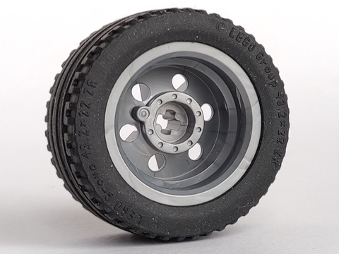 LEGO wheel 56145c01 with dark gray reinforced rim and black 43.2 x 22 ZR tire, showing hub detail.