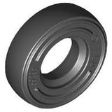 Dark grey LEGO tire, 14mm D. x 4mm, smooth, with embossed numbers on the side.