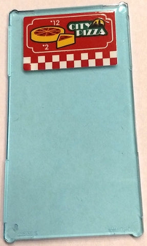 Light blue LEGO window with 'CITY PIZZA' sticker, numbers 12 and 2, pizza graphics, and red/white checkered pattern.