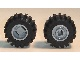 Pair of LEGO 6014bc03 wheels with black offset tread tires, raised grooves, and grey rims.