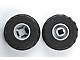 Two LEGO wheels with black tires and light gray hubs, one with a 5-point star hole and the other with a square notched hole.