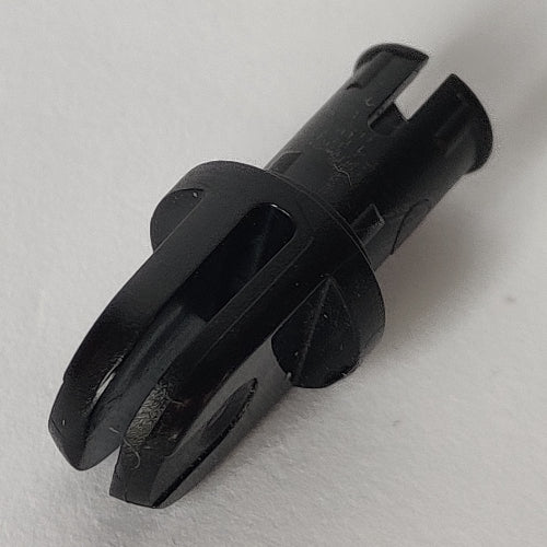 Close-up of a black LEGO 6048b arm piece with a pin on one end, two fingers, and a central flange, against a white background.