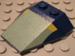 LEGO 6069px4 dark blue 4x4 triple wedge with sand green and yellow Mini Slave I pattern, showing studs on a white base.