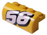 Yellow LEGO curved slope 2x4 with 4 recessed studs, featuring a white number 56 pattern, left side.