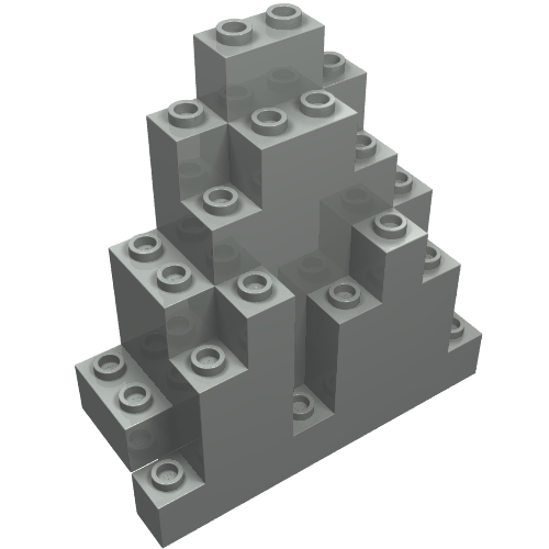 Grey LEGO 6083 Rock Panel, 3x8x7 triangular, with studs visible on the top and sides of its stepped structure.