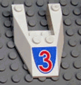 A white LEGO Wedge 6 x 4 Cutout without Stud Notches piece with a red number 3 on a curved blue background pattern.