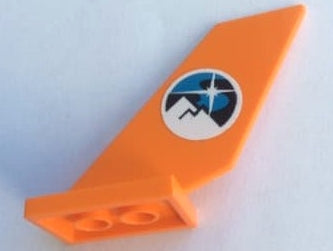 An orange LEGO tail shuttle piece with a circular white sticker displaying a blue and black arctic logo featuring mountains and a star.