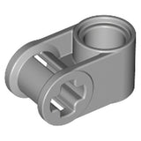 A light grey LEGO Technic Axle and Pin Connector Perpendicular (part 6536) on a white background, viewed from an angle.