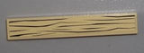 Tan LEGO 1x6 tile with a dark brown wood grain pattern printed on its surface.