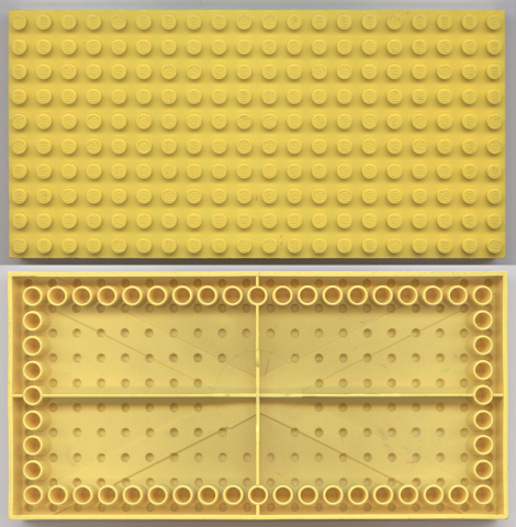 Yellow LEGO 10x20 plate, top with studs, bottom with tubes around edge and '+' cross support.