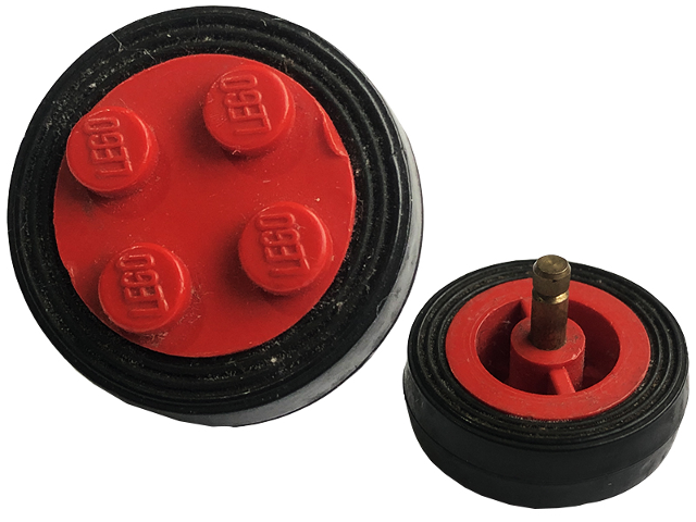 LEGO 7039c01 wheel with red 4-stud hub, black tire, and metal axle shown from top and side views.