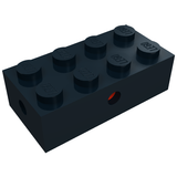 Dark grey LEGO 2x4 modified brick with side pin holes, one revealing a red interior.