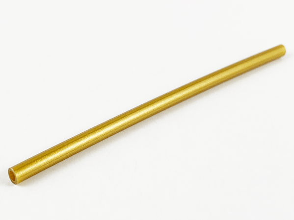 Golden rigid LEGO hose (part 75c10) 3mm diameter, 8cm long, on a white background, showing hollow end.