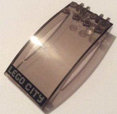 Trans-smoke curved LEGO windscreen 8x4x2 with studs, featuring white dotted 'LEGO CITY' text on a black background sticker.