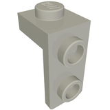 A light gray LEGO 79389 Bracket 1 x 1 - 1 x 2 piece, with a single stud on top and two studs on the side.